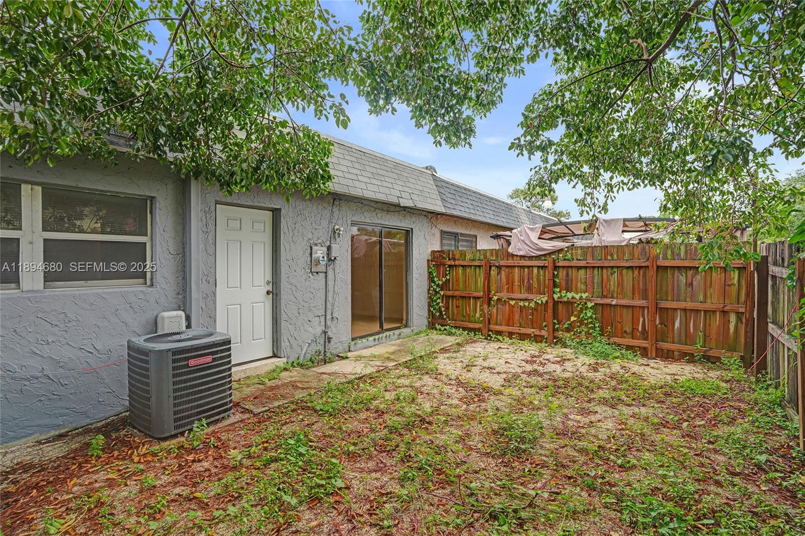 3876 Northwest 207 St Road Miami Gardens, FL 33055 - Photo 32 of 37 a view of backyard and wooden fence