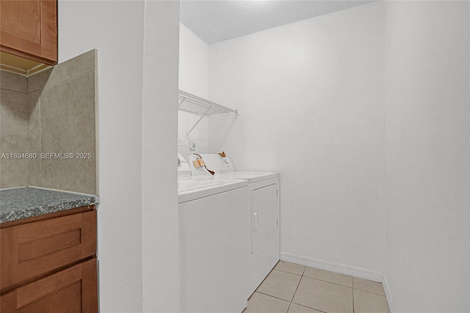 3876 Northwest 207 St Road Miami Gardens, FL 33055 - Photo 5 of 37 a utility room with a sink