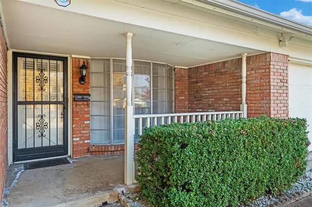 a view of a back yard from a balcony