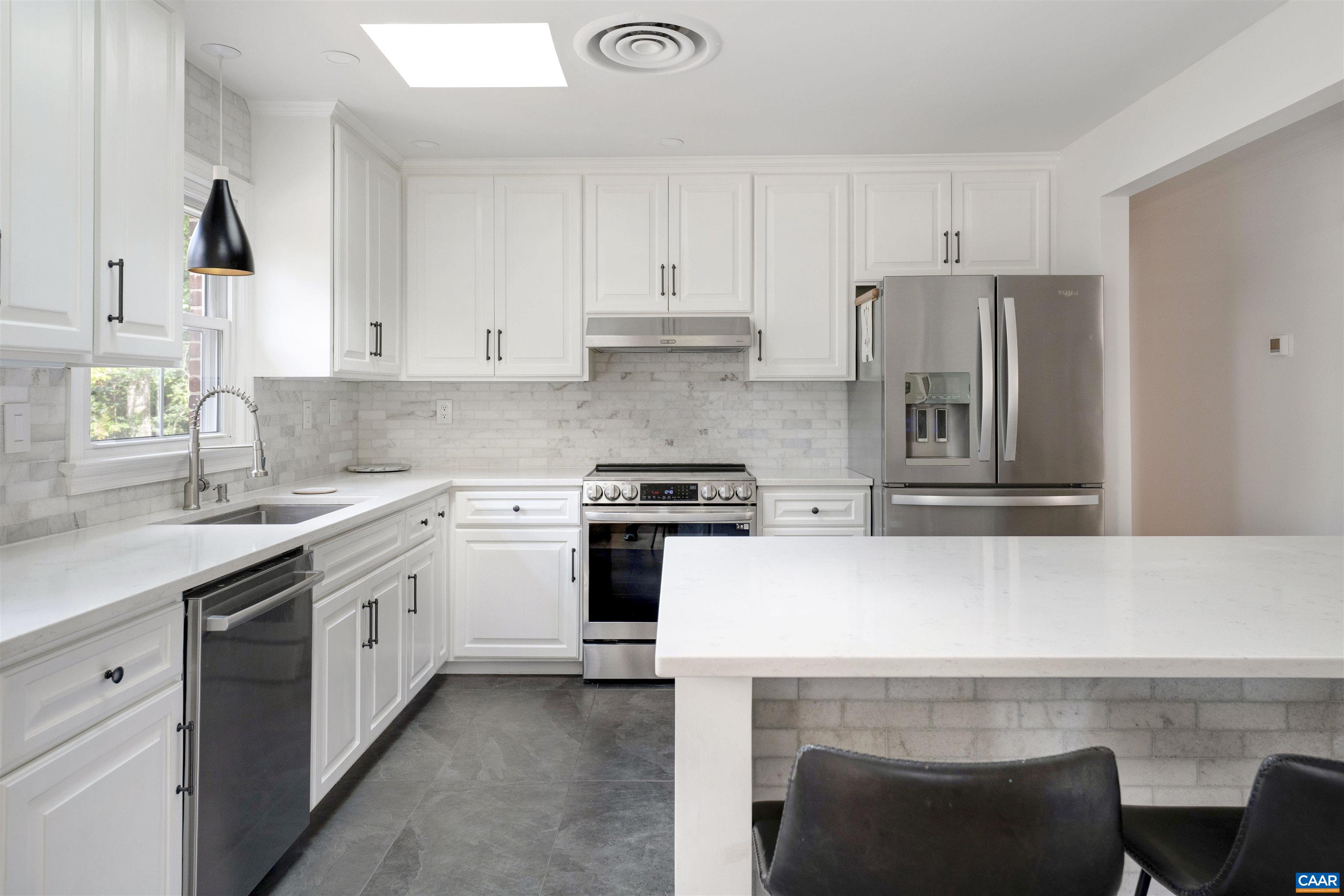 205 Chaucer Road Charlottesville, VA 22901 - Photo 15 of 43 a kitchen with a stove a sink and a refrigerator