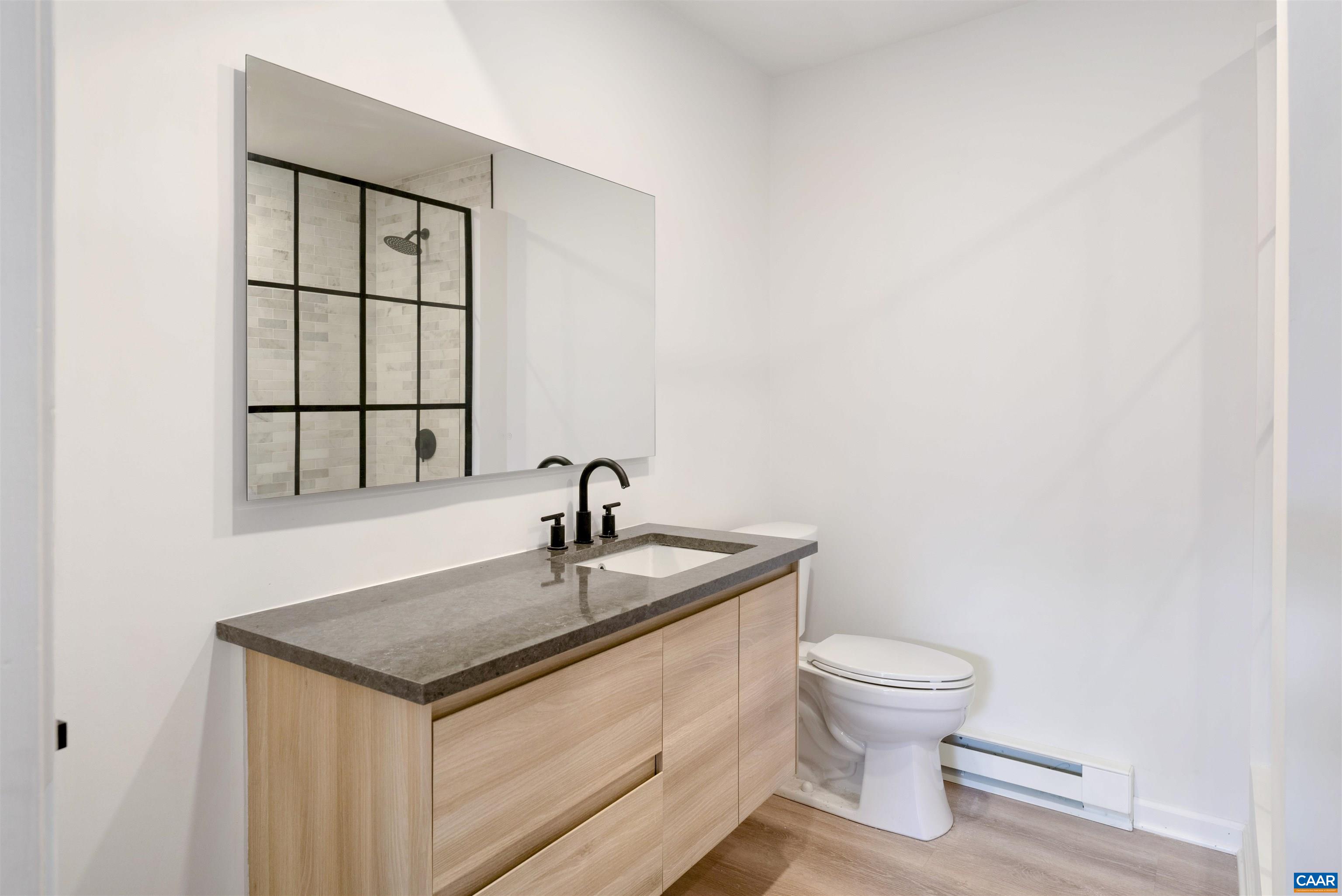 205 Chaucer Road Charlottesville, VA 22901 - Photo 30 of 43 a bathroom with a sink toilet and window