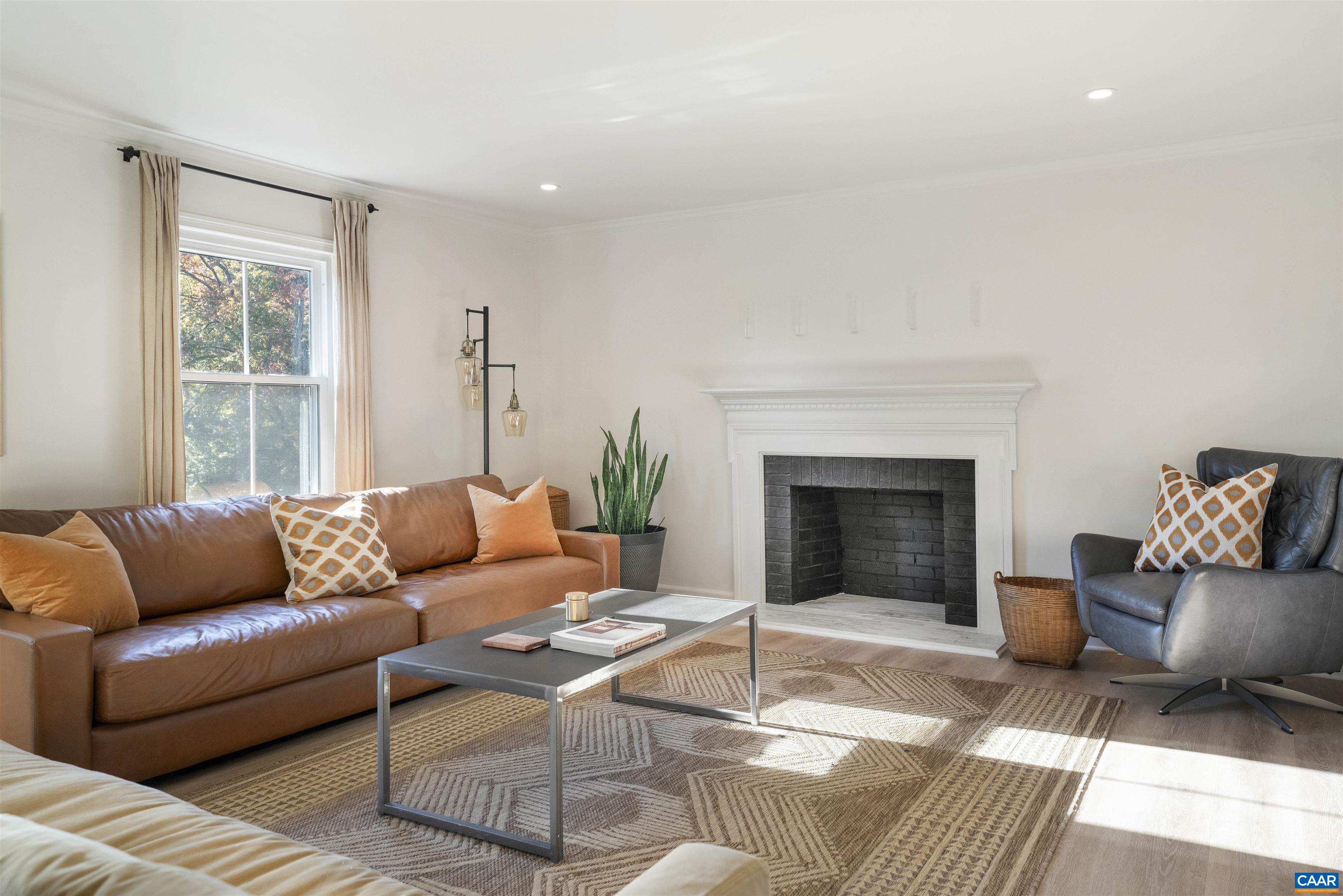 205 Chaucer Road Charlottesville, VA 22901 - Photo 4 of 43 a living room with furniture and a fireplace