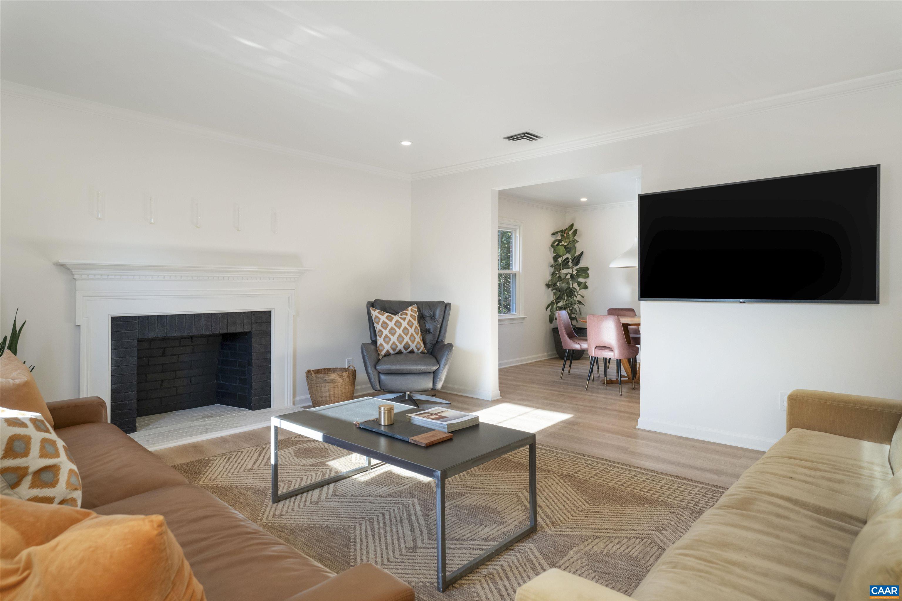 205 Chaucer Road Charlottesville, VA 22901 - Photo 6 of 43 a living room with furniture and a flat screen tv