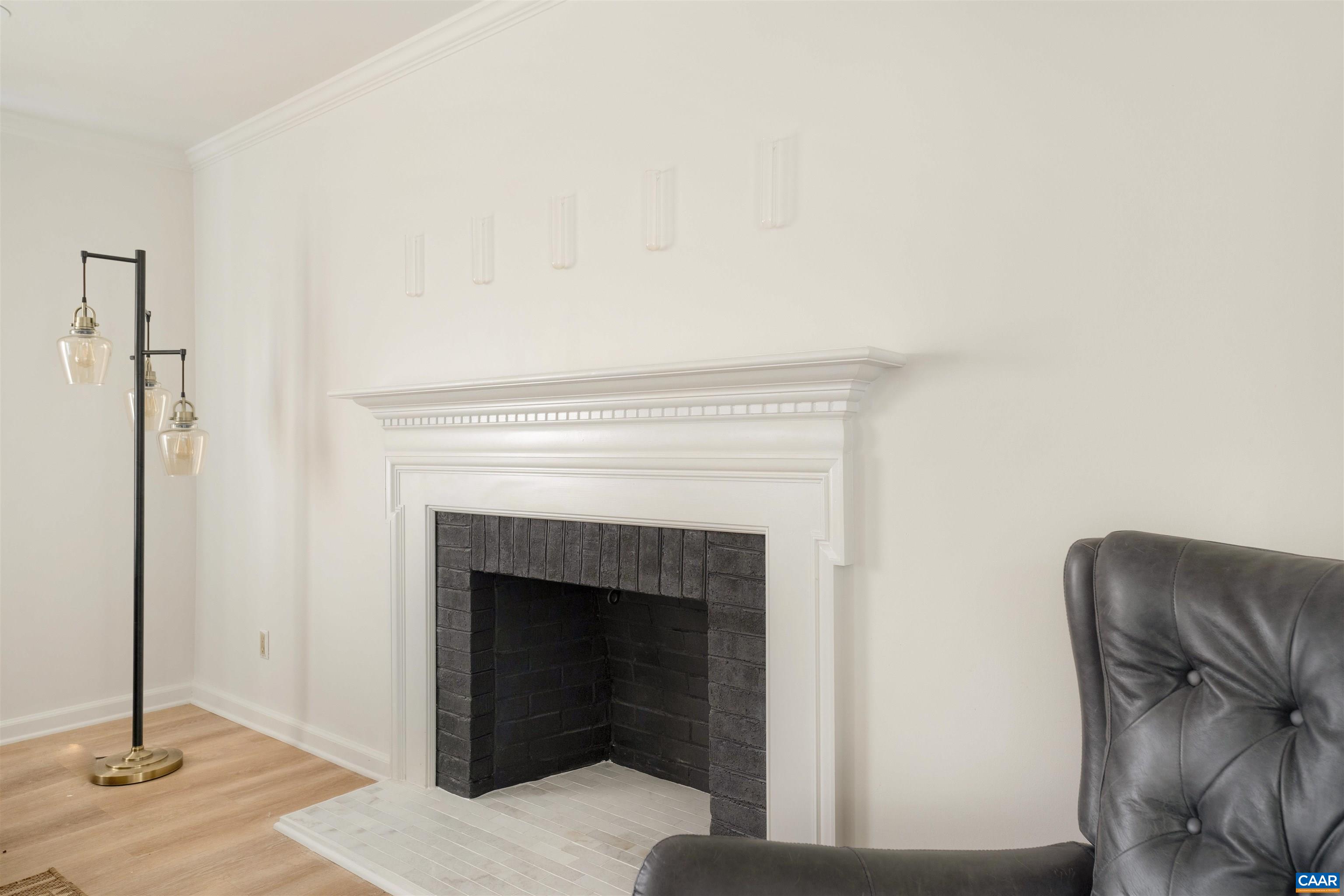 205 Chaucer Road Charlottesville, VA 22901 - Photo 7 of 43 a living room with furniture and a fireplace