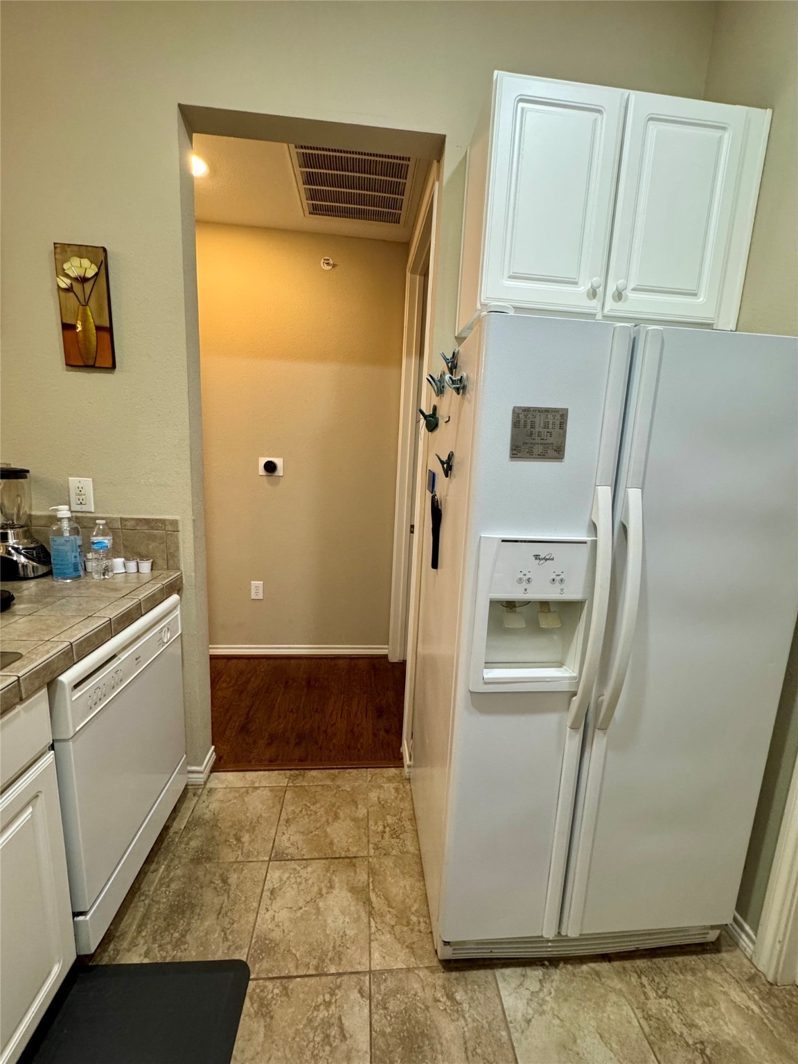2400 McCue Road, Unit 233 Houston, TX 77056 - Photo 17 of 41 a kitchen with a refrigerator and cabinets