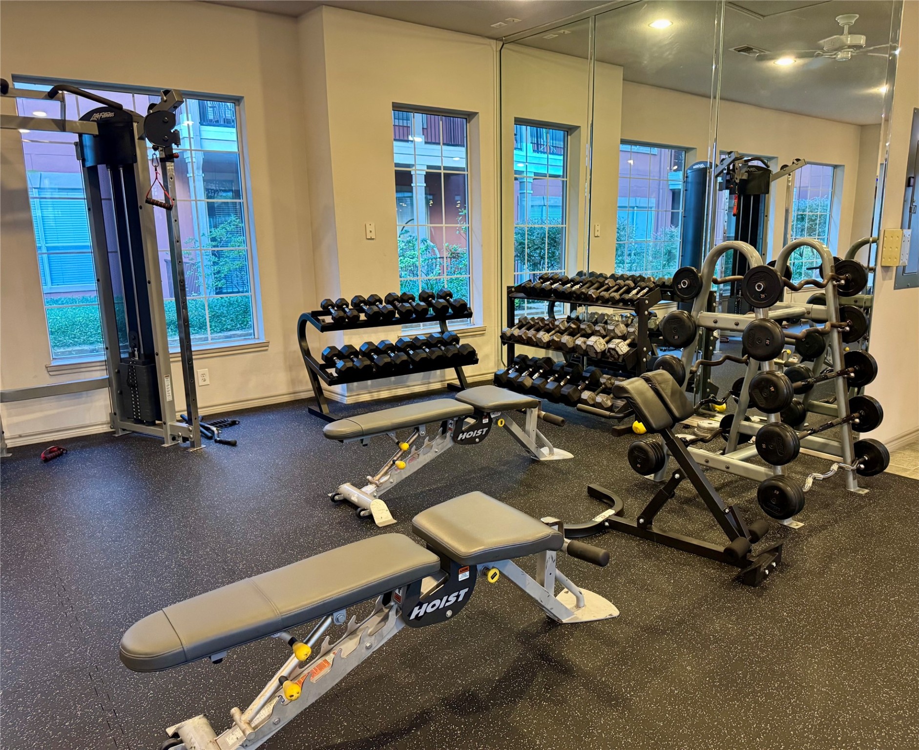 2400 McCue Road, Unit 233 Houston, TX 77056 - Photo 35 of 41 a room with gym equipment and a large window