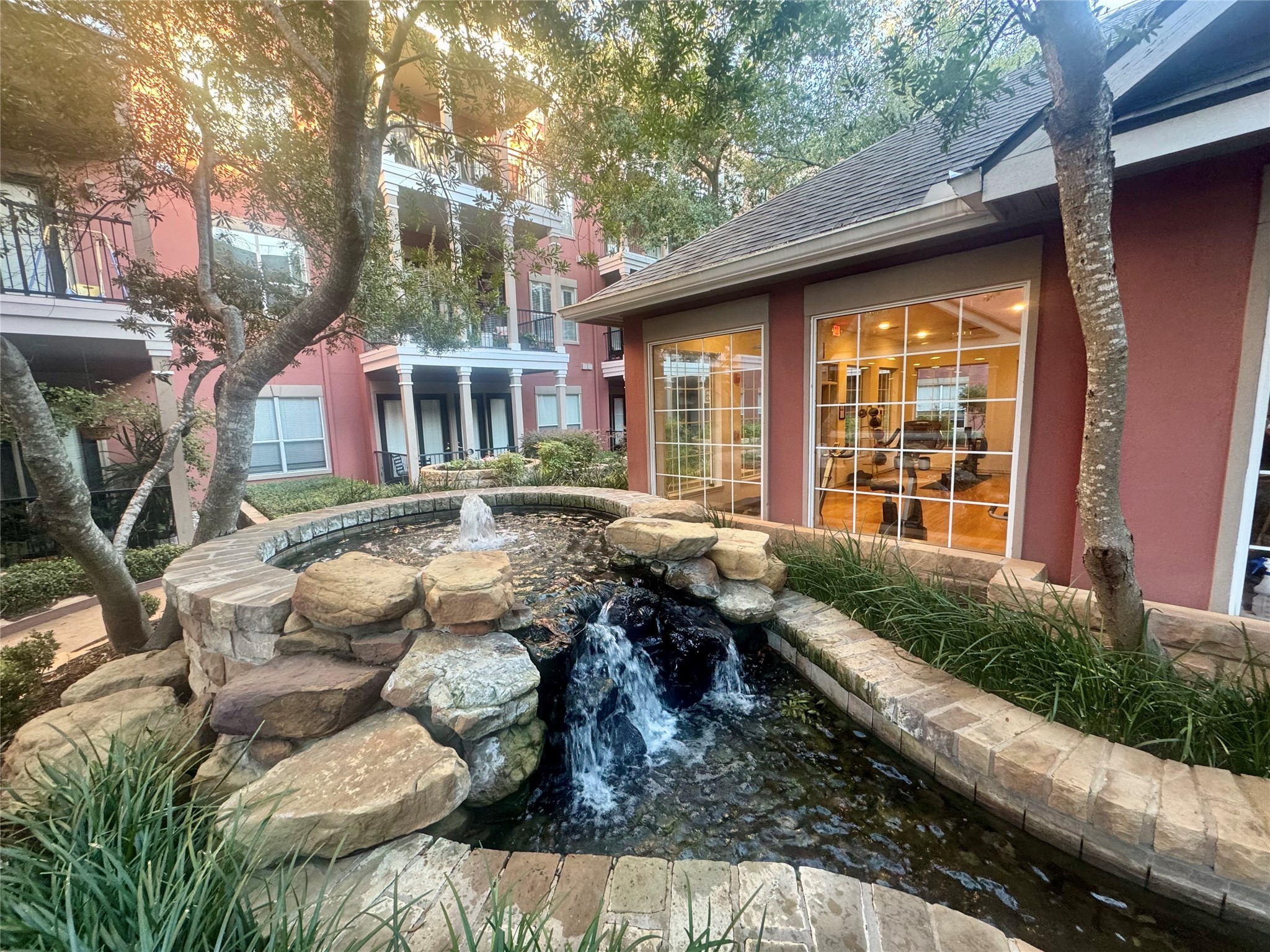 2400 McCue Road, Unit 233 Houston, TX 77056 - Photo 38 of 41 a front view of a house with garden