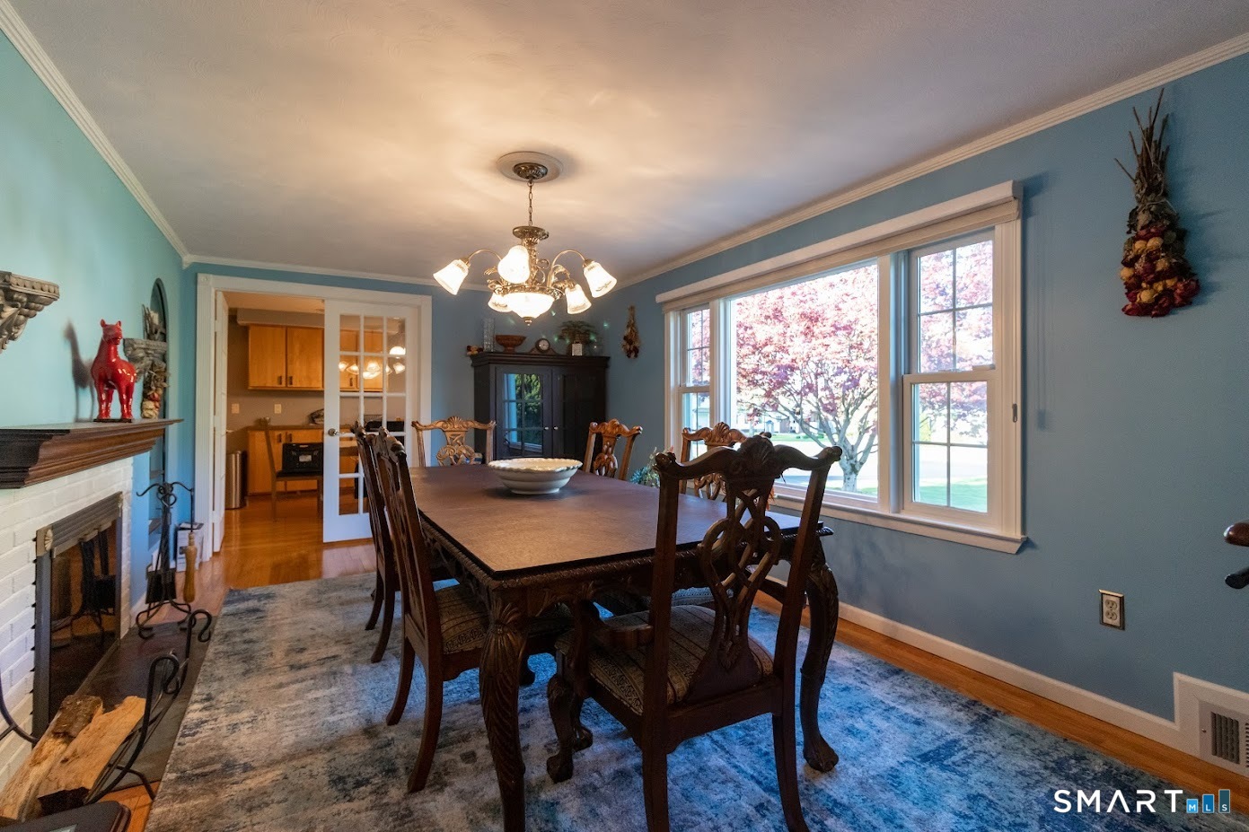 763 North Street Suffield, CT 06078 - Photo 17 of 40 a view of a dining room with furniture window and wooden floor
