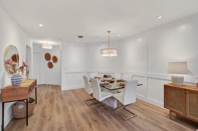 a kitchen with stainless steel appliances a stove a sink a refrigerator and cabinets