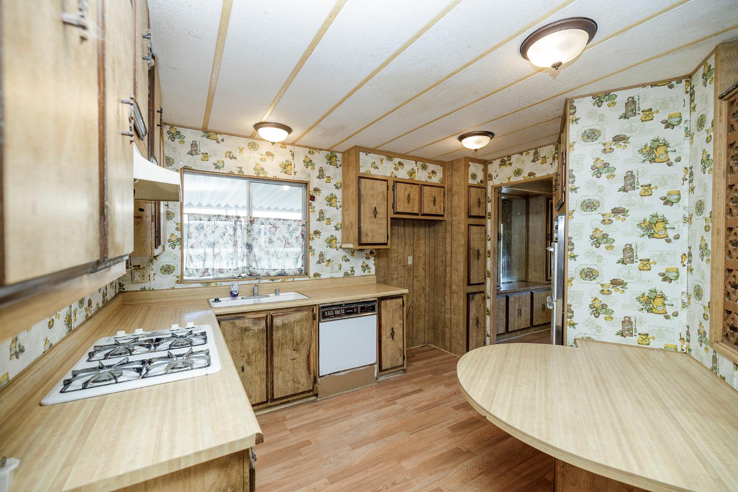 2621 Prescott Road, Unit 158 Modesto, CA 95350 - Photo 15 of 35 a kitchen with a sink a stove and a refrigerator