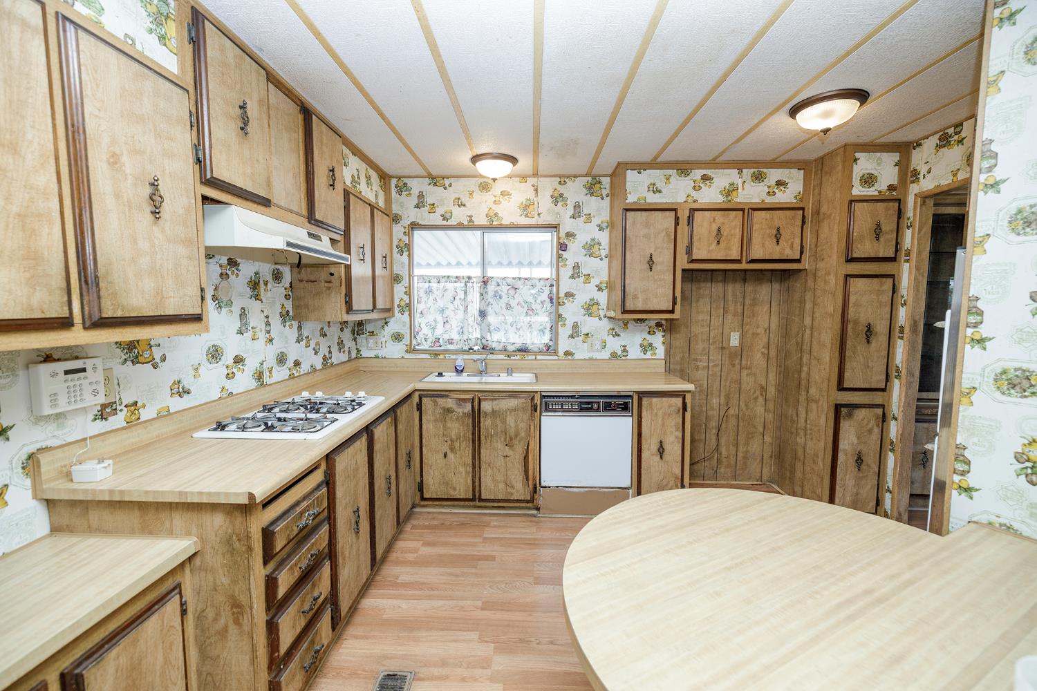 2621 Prescott Road, Unit 158 Modesto, CA 95350 - Photo 16 of 35 a kitchen with a sink stove and refrigerator