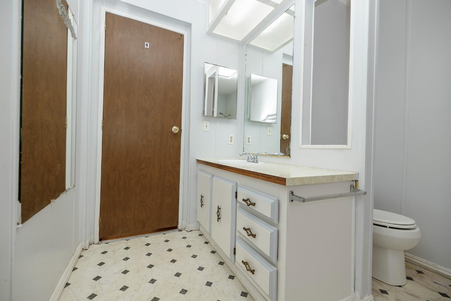 2621 Prescott Road, Unit 158 Modesto, CA 95350 - Photo 27 of 35 a bathroom with a sink a toilet a shower and a mirror