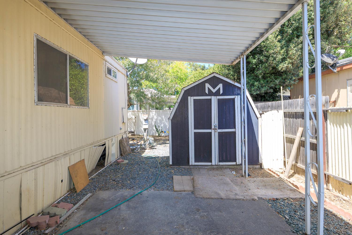 2621 Prescott Road, Unit 158 Modesto, CA 95350 - Photo 5 of 35 a view of a house with a backyard and porch