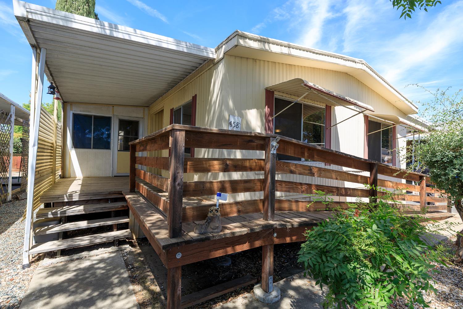 2621 Prescott Road, Unit 158 Modesto, CA 95350 - Photo 7 of 35 a front view of a house with a yard