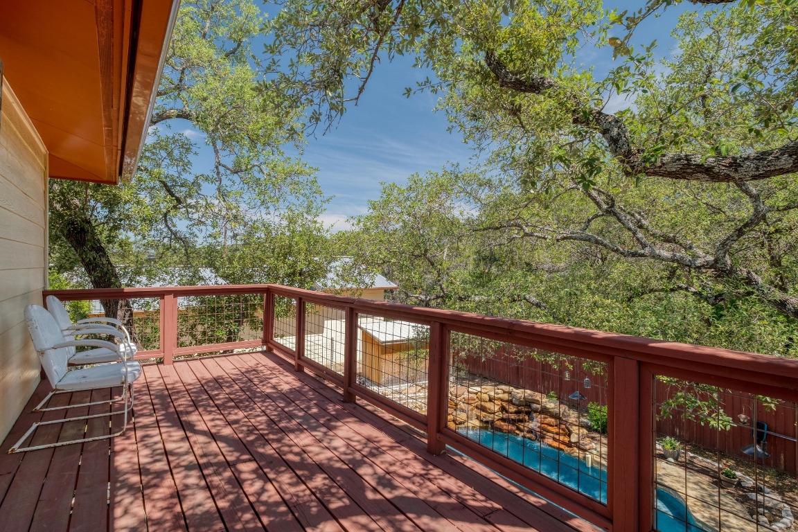 7600 Deer Run Road Leander, TX 78641 - Photo 22 of 39 a view of a balcony with wooden floor