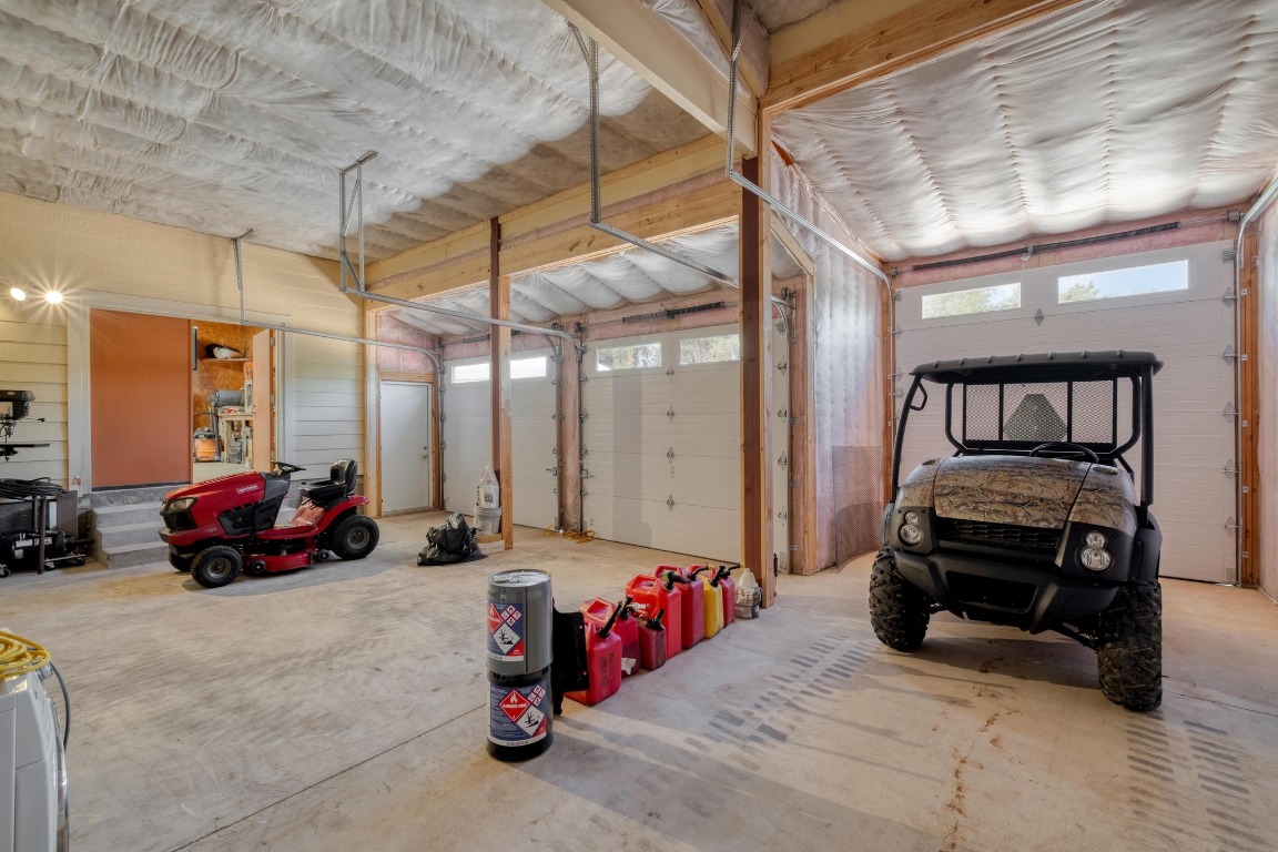 7600 Deer Run Road Leander, TX 78641 - Photo 31 of 39 a garage with a couch and a chandelier