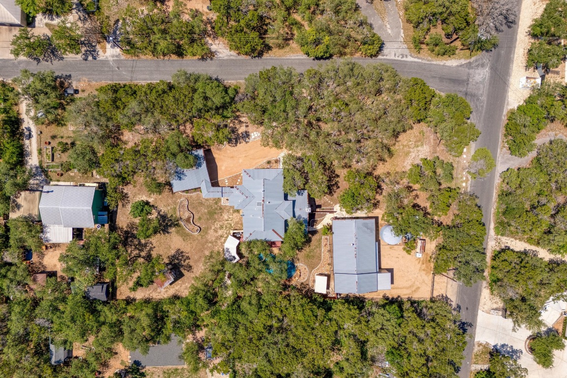 7600 Deer Run Road Leander, TX 78641 - Photo 37 of 39 an aerial view of a house with a yard and trees all around