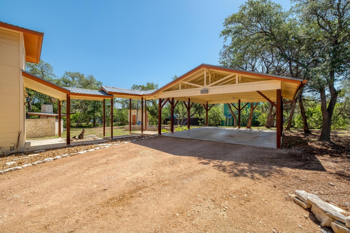7600 Deer Run Road Leander, TX 78641 - Photo 4 of 39 a view of patio with a table and chairs under an umbrella
