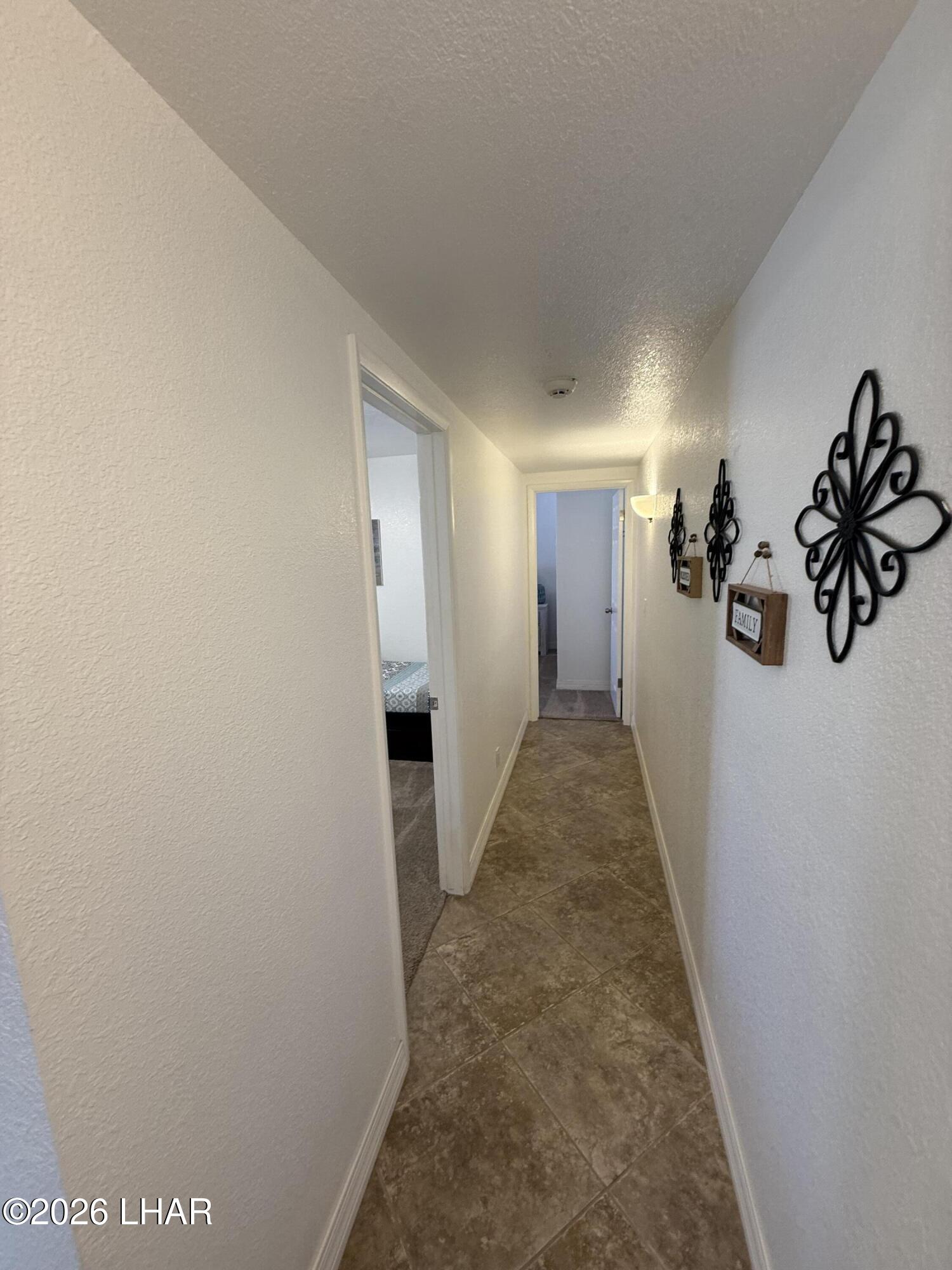 375 London Bridge Road, Unit 35 Lake Havasu City, AZ 86403 - Photo 36 of 43 HALLWAY TO BEDROOM 2 AND 3