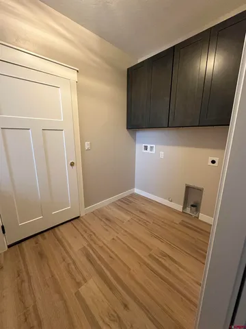 a view of a livingroom with wooden floor