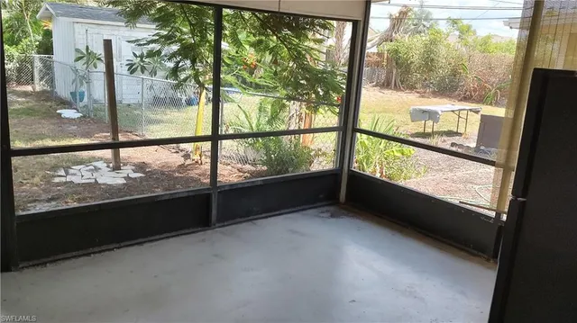 a view of an empty room with a large window