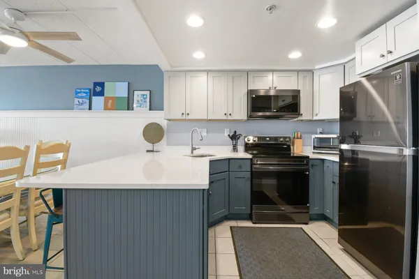 a bedroom with a large bed and a large window