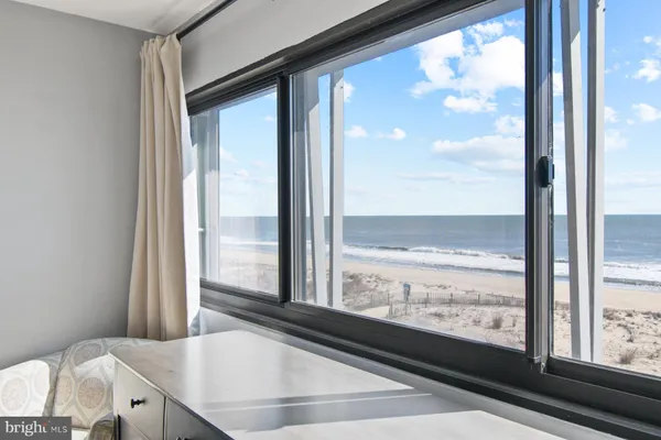 a bedroom with bed and window