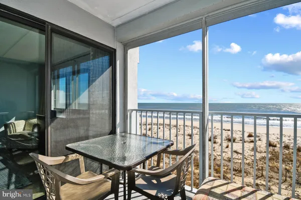 a view of a balcony with furniture