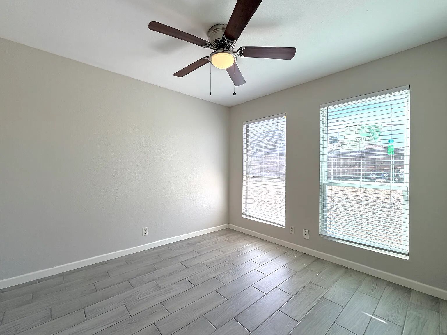 209 East Noton Street, Unit 109 Pflugerville, TX 78660 - Photo 7 of 11 a view of an empty room with a window