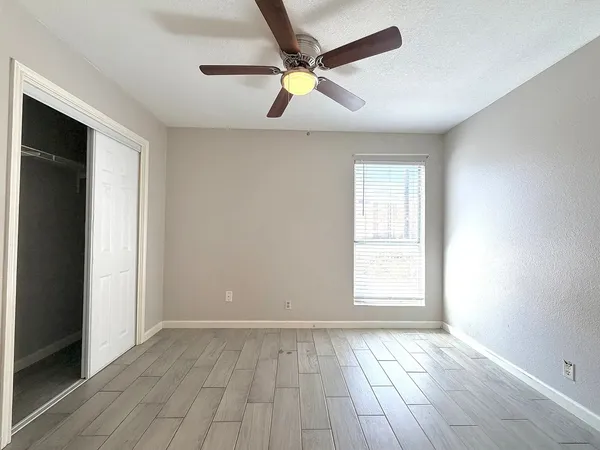 a white toilet sitting next to a bath tub shower