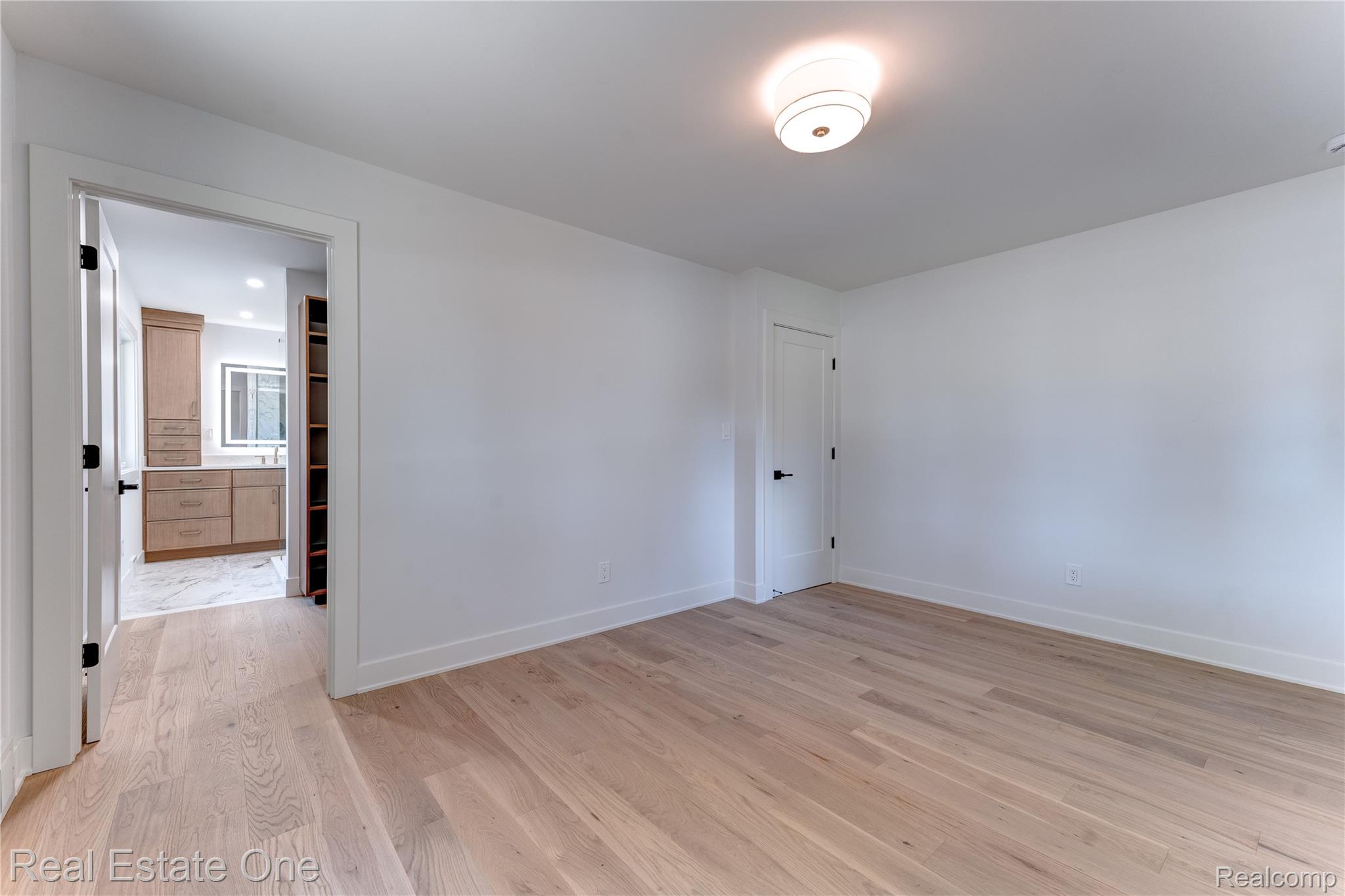 786 South Cranbrook Road Bloomfield Hills, MI 48301 - Photo 23 of 38 Spare room featuring light wood finished floors and baseboards