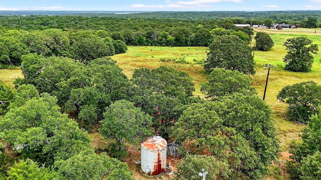 2887 Liberty Road Gordonville, TX 76245 - Photo 14 of 40 a view of a lake with a house in the background