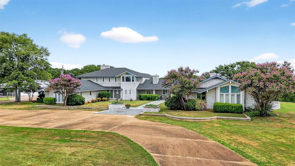 2887 Liberty Road Gordonville, TX 76245 - Photo 16 of 40 a front view of a house with a yard