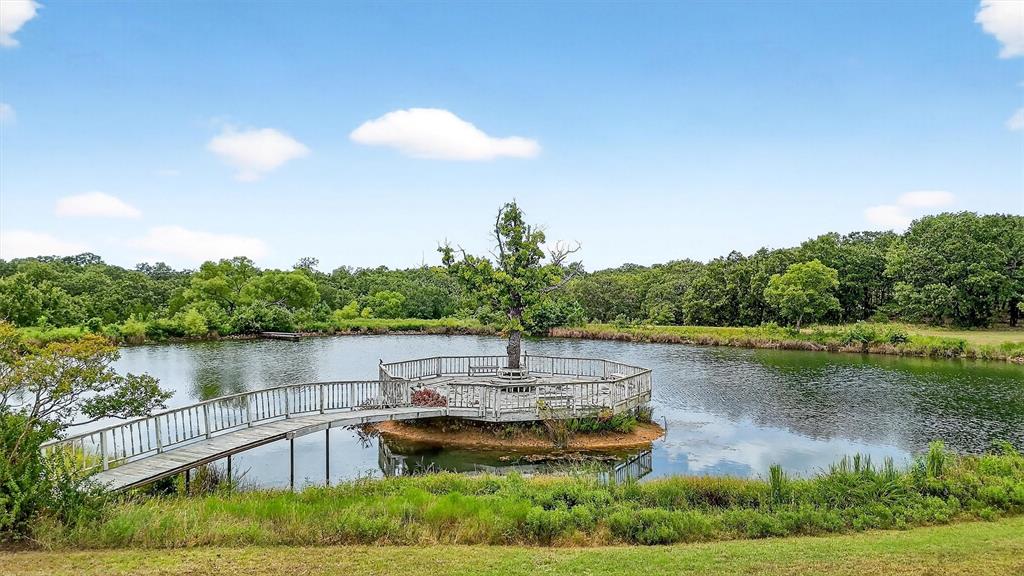 2887 Liberty Road Gordonville, TX 76245 - Photo 17 of 40 a view of a lake with houses in the back