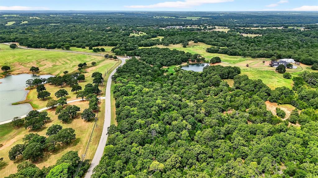 2887 Liberty Road Gordonville, TX 76245 - Photo 19 of 40 an aerial view of residential houses with outdoor space and trees