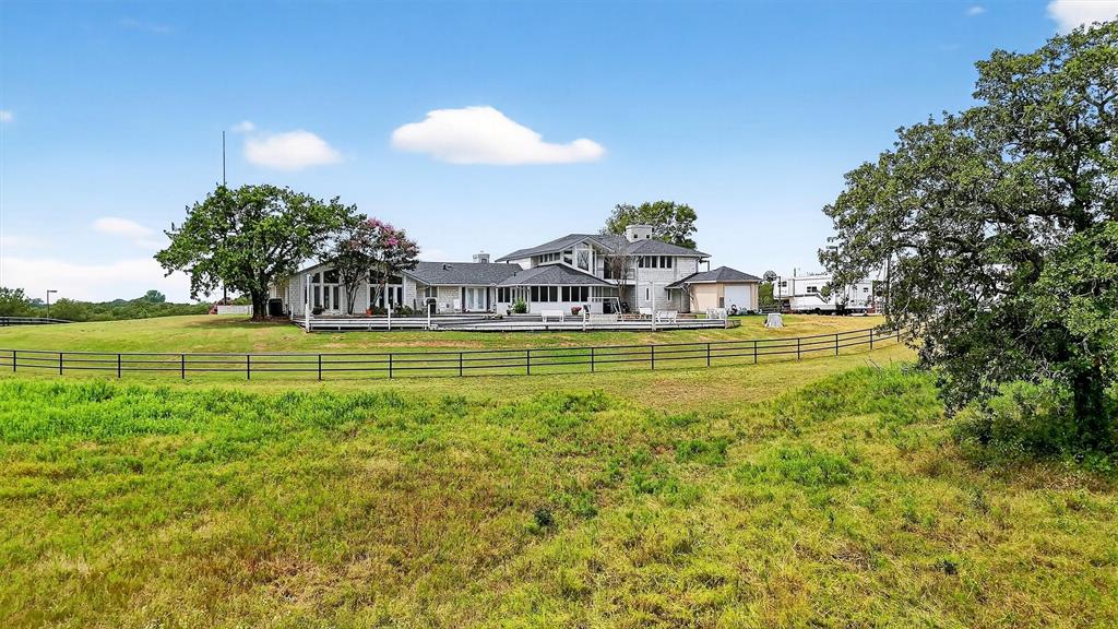 2887 Liberty Road Gordonville, TX 76245 - Photo 21 of 40 a view of a swimming pool with an outdoor space and seating area