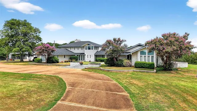 a front view of a house with yard