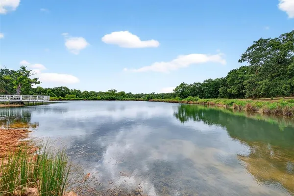 a front view of house with yard and outdoor seating