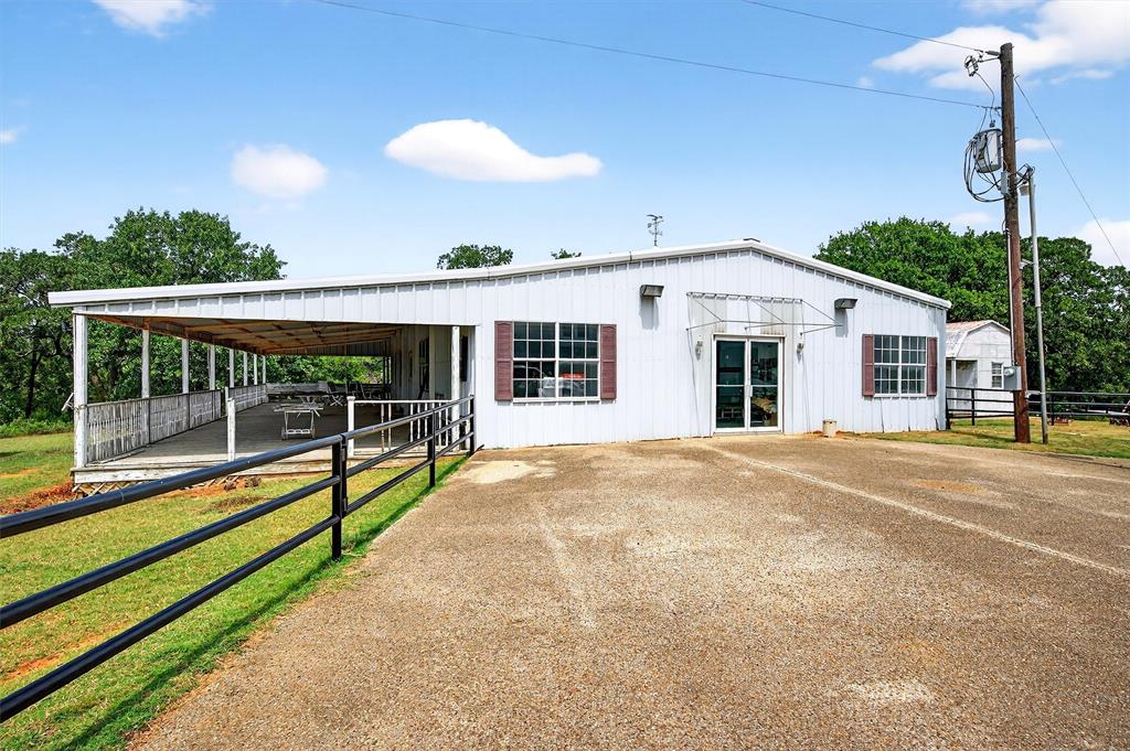 2887 Liberty Road Gordonville, TX 76245 - Photo 37 of 40 a view of a house with backyard and porch