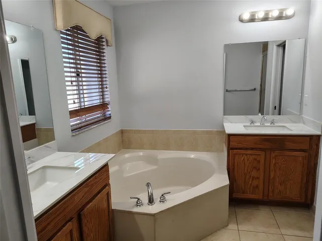 a bathroom with a bathtub and a sink