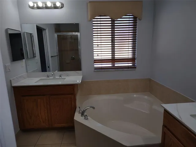 a bathroom with a bathtub and a sink