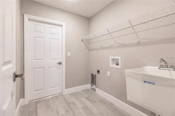a view of empty room with closet and wooden floor