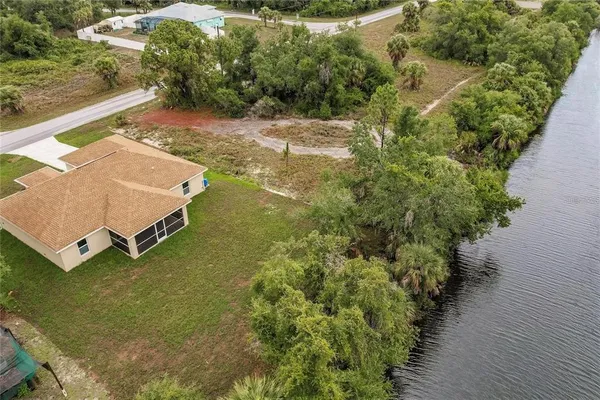 an aerial view of a house with a yard