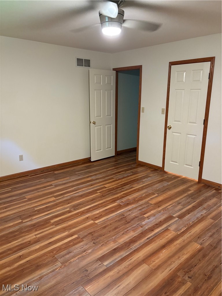6695 Clingan Road, Unit 24 Youngstown, OH 44514 - Photo 13 of 26 Unfurnished bedroom with wood finished floors and a ceiling fan