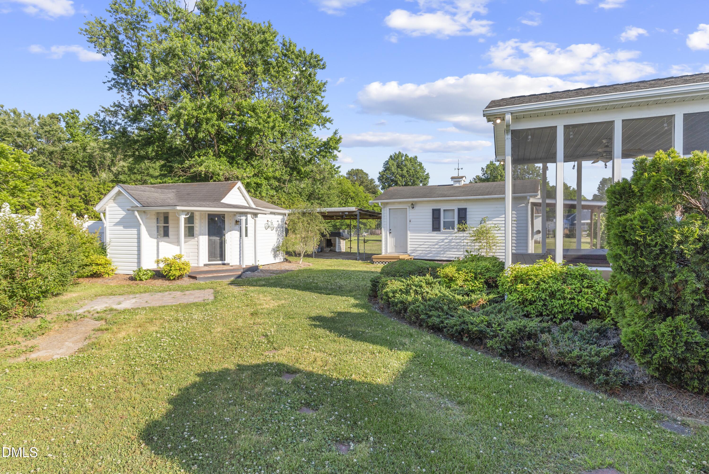 199 Iris Bryant Road Erwin, NC 28339 - Photo 21 of 33 a view of a house with backyard and sitting area