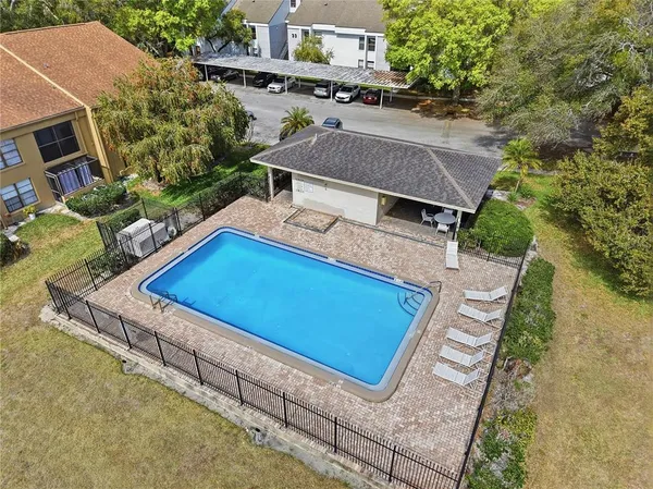 an aerial view of a house with swimming pool