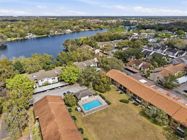an aerial view of a house with a lake view