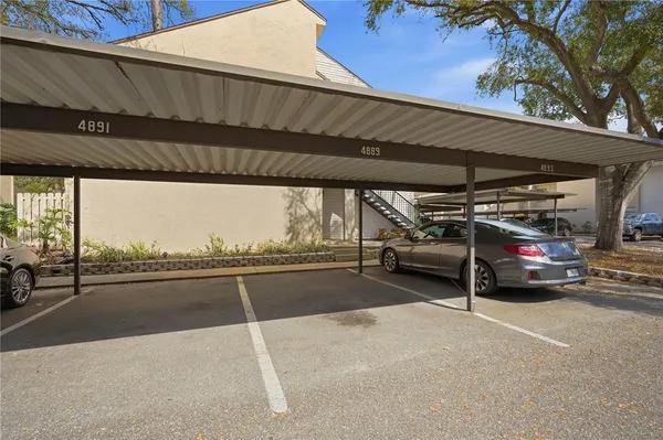 a view of parking garage with cars