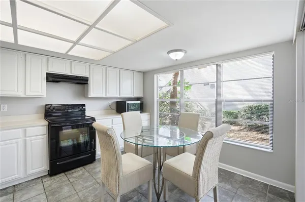 a kitchen with a stove a sink and a refrigerator