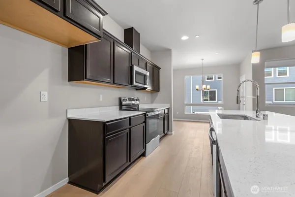 a kitchen with a sink and stove